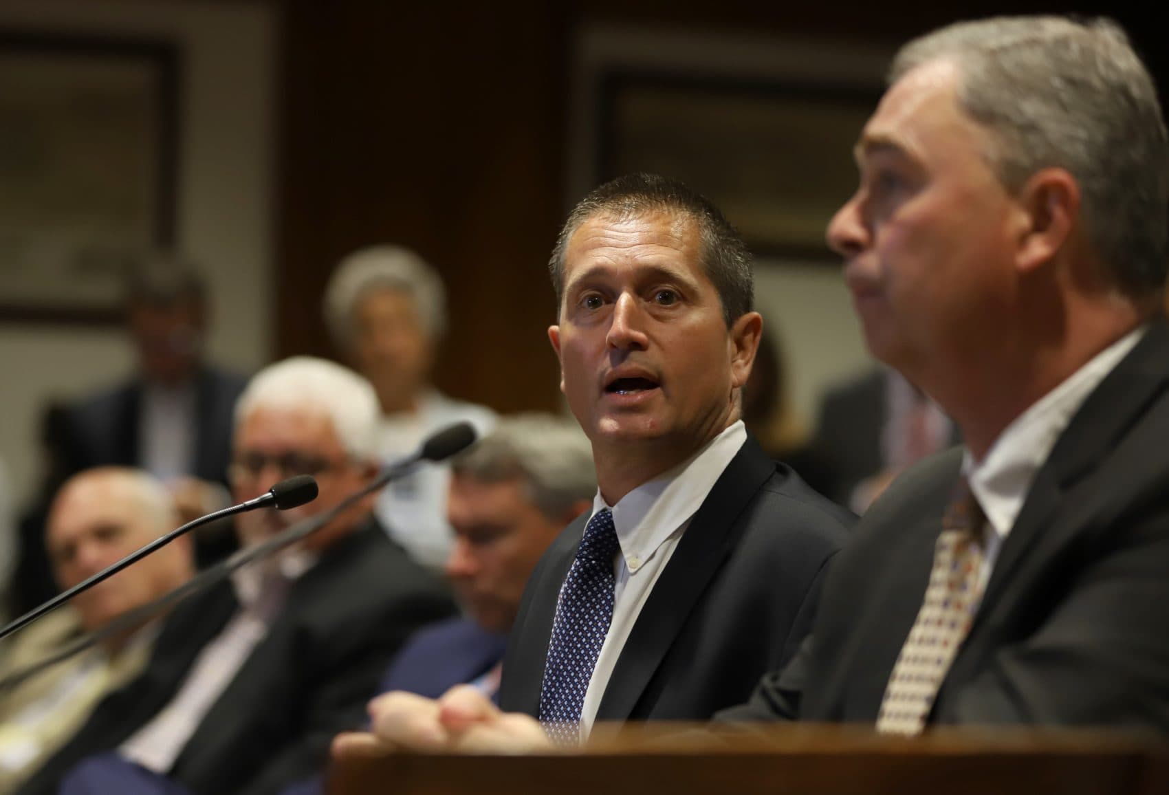 Beverly City Council President Paul Guanci, who owns a local sub shop, told lawmakers that he has had to scale back how many high-school students he hires as part-time employees because of the higher minimum wage. (Sam Doran/SHNS)