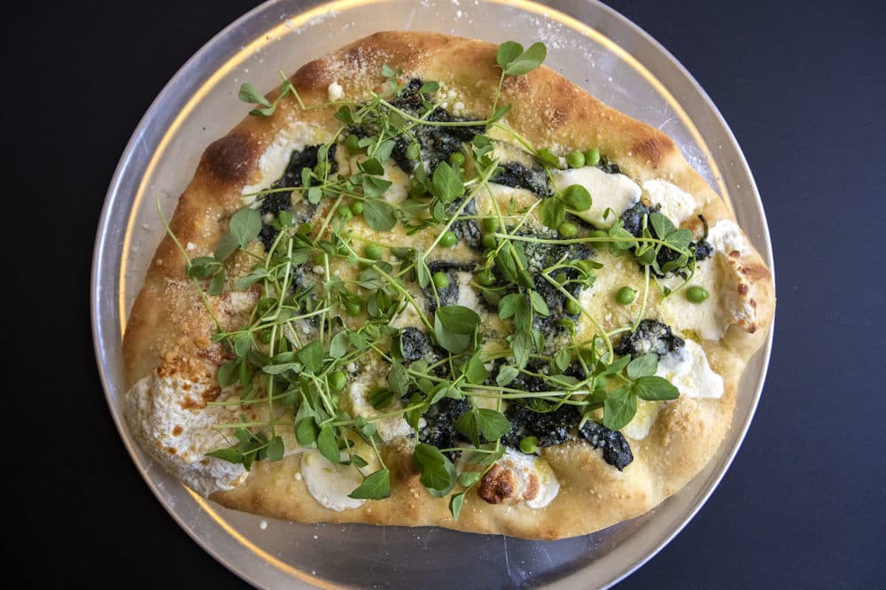 Chef Kathy Gunst's fresh pea and spinach pizza with pea sprouts. (Jesse Costa/WBUR)