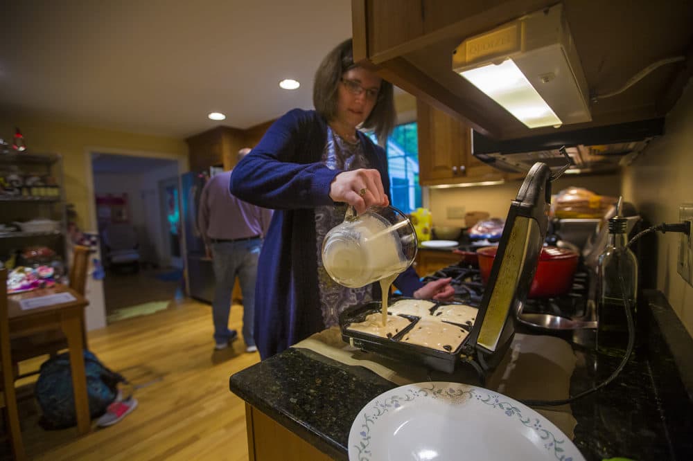 Kristin Heres makes waffles for her daughter Anya's breakfast. (Jesse Costa/WBUR)