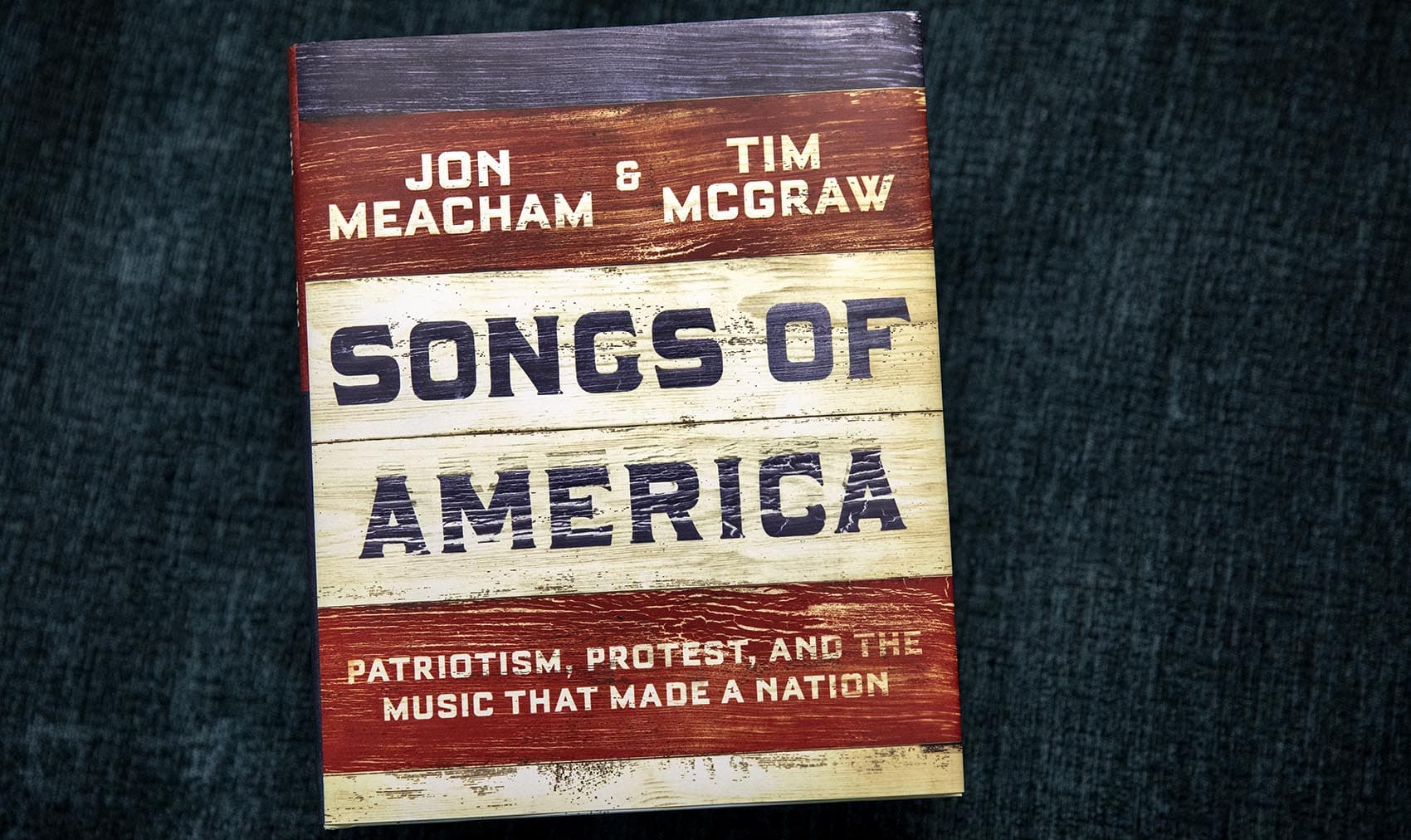 "Songs Of America: Patriotism, Protest, And The Music That Made A Nation," by Jon Meacham and Tim McGraw. (Robin Lubbock/WBUR)
