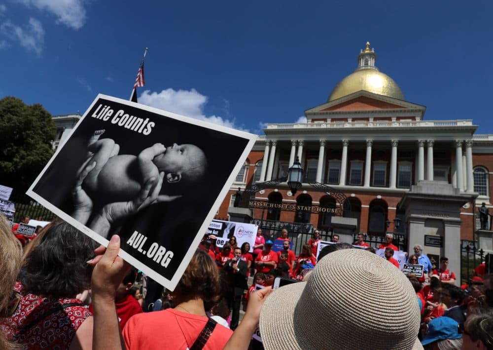 Pro-life activists rallied in front of the State House Monday morning ahead of a public hearing on the so-called ROE Act, which would legalize abortions after 24 weeks under certain circumstances. (Sam Doran/SHNS)