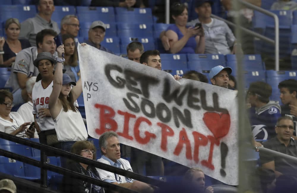 Tampa Bay Rays fans hold up a sign with encouraging words for former Boston Red Sox player David Ortiz during the seventh inning of the Rays' baseball game against the Los Angeles Angels on Thursday. (Chris O'Meara/AP)
