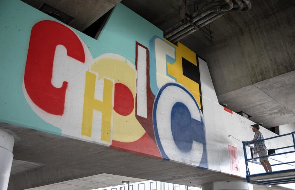 Greg Lamarche's mural, "Choice," in progress. (Robin Lubbock/WBUR)