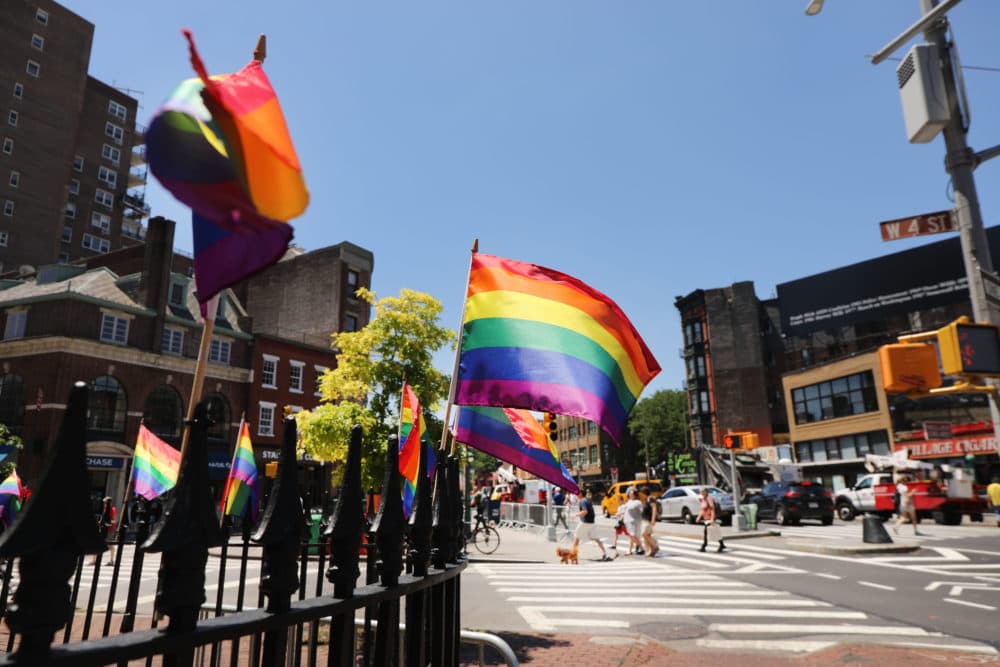 Rainbow pride flags fly outside the Stonewall Inn as crowds begin to gather to celebrate Pride Month in New York City. Thousands of members of the LGBTQ community have been gathering outside of the historic gay bar in Greenwich Village to celebrate the 50th anniversary of riots at the inn, which many consider the birth of the modern gay rights movement in America. (Spencer Platt/Getty Images)