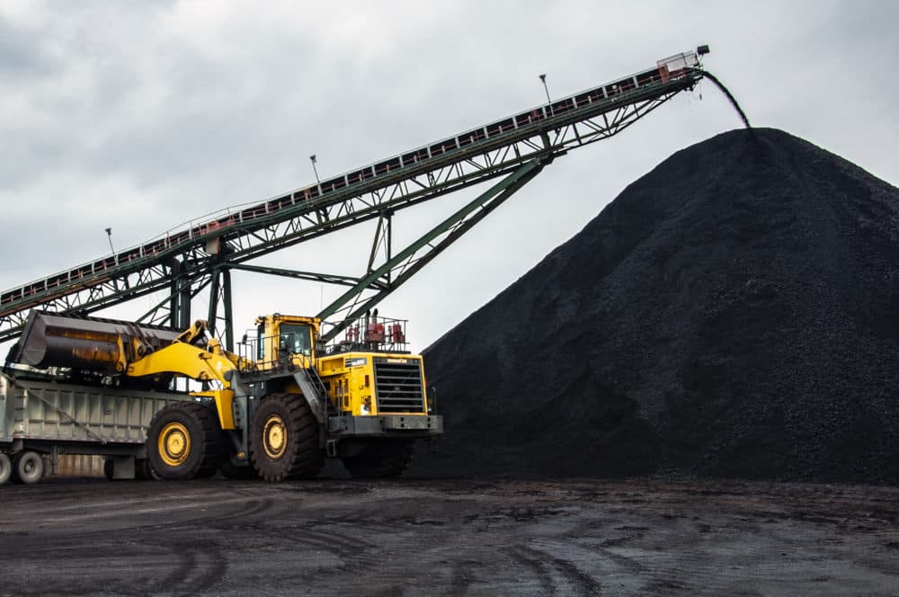 Coal pours off a conveyor belt on the surface of an underground coal mine in Muhlenberg County, Kentucky. (Chris Bentley/Here & Now)