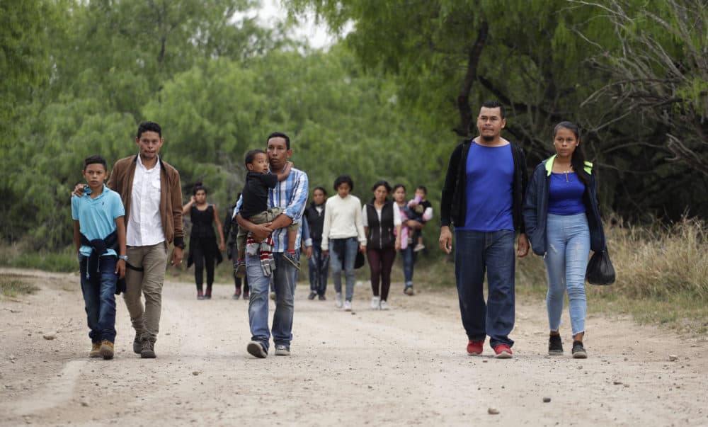 In this Thursday, March 14, 2019, photo, a group of migrant families walk from the Rio Grande, the river separating the U.S. and Mexico in Texas, near McAllen, Texas. (Eric Gay/AP)