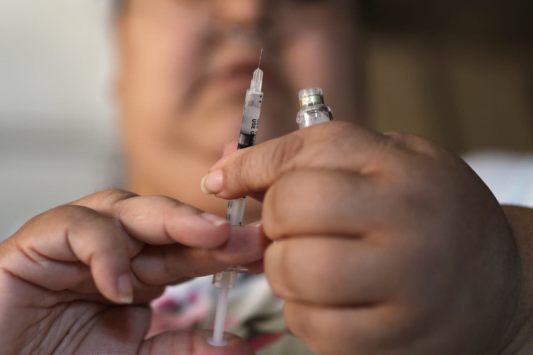 In this 2017 file photo, a woman with Type 2 diabetes prepares to inject herself with insulin at her home in Las Vegas. (John Locher/AP)