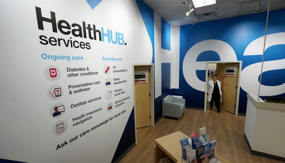 Family Nurse Practitioner Serena Lopez exits an exam room at the new HealthHUB inside a CVS store in Spring, Texas. (David J. Phillip/AP)