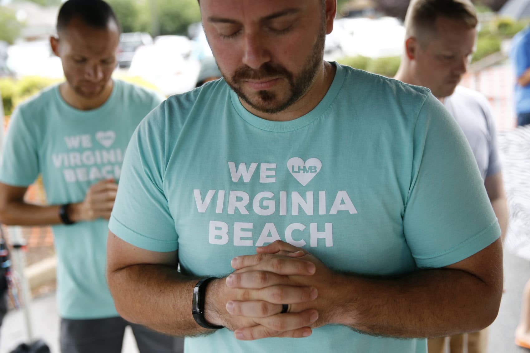 People gather to pray during a vigil in response to a fatal shooting at a municipal building in Virginia Beach, Va., Saturday, June 1, 2019. (Patrick Semansky/AP)