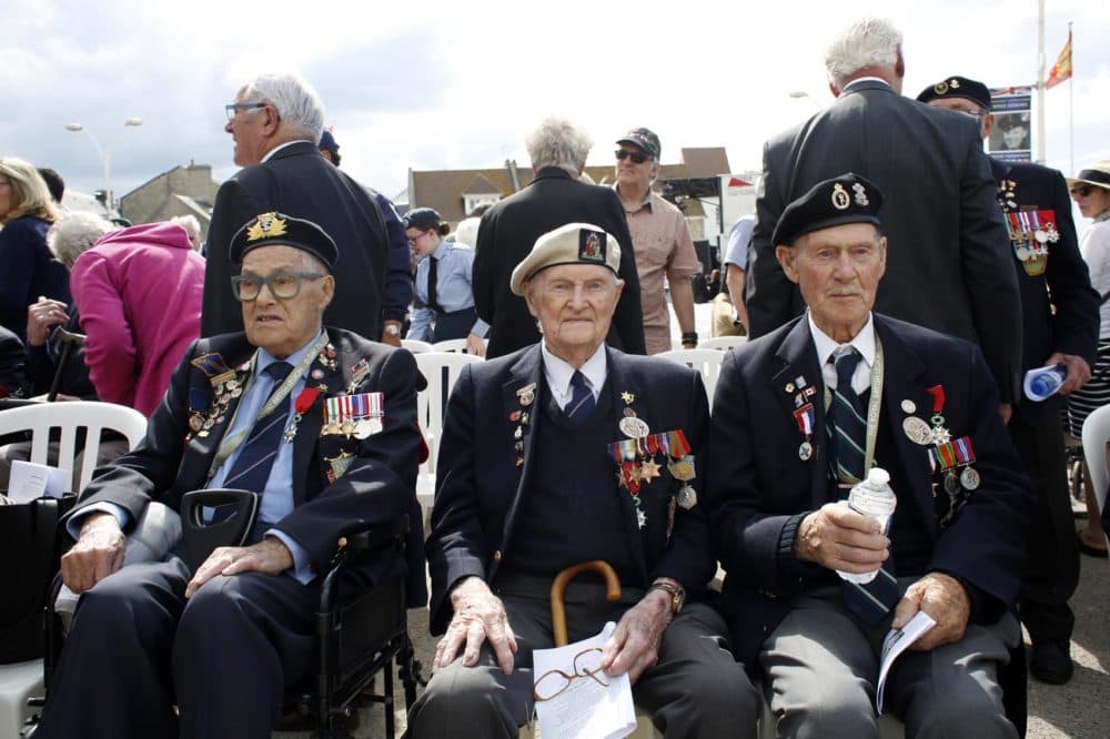 British D-Day veteran Cyril Banks, center, sits with two fellow veterans during an event to mark the 75th anniversary of D-Day in Arromanches, Normandy, France, Thursday, June 6, 2019. (Thibault Camus/AP)