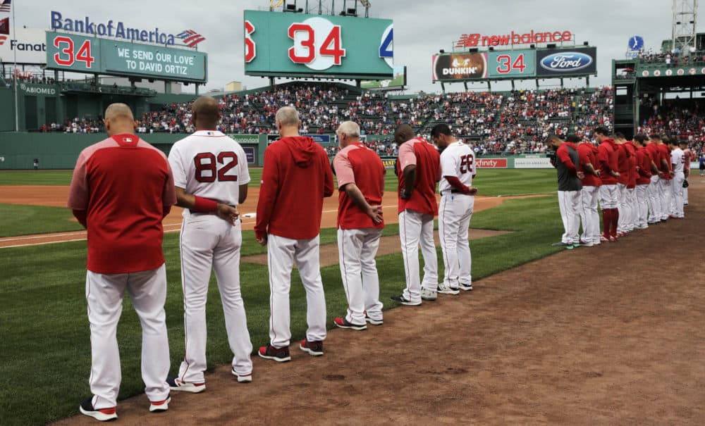 The Boston Red Sox and fans pause for a moment for Ortiz, who was shot Sunday evening in the Dominican Republic, prior to a game Monday against the Texas Rangers. (Charles Krupa/AP)
