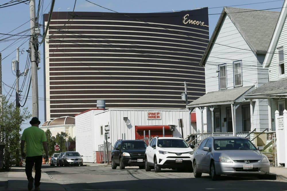 Encore Boston Harbor casino looms above the surrounding neighborhood in Everett, Mass. (Michael Dwyer/AP File Photo)