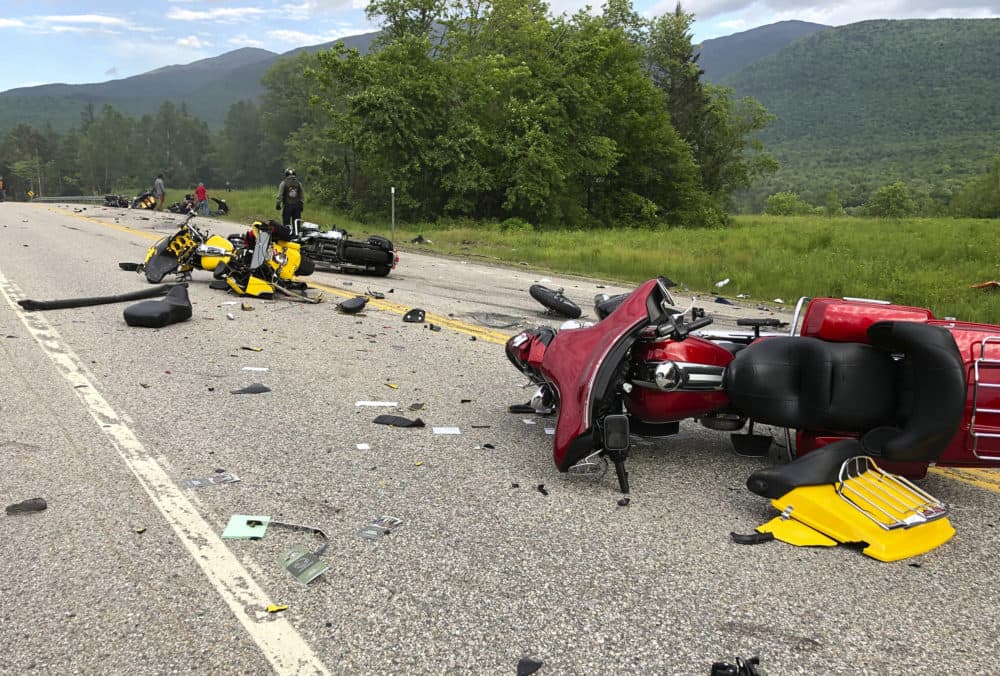 This photo provided by Miranda Thompson shows the scene where several motorcycles and a pickup truck collided on a rural, two-lane highway in Randolph, N.H. (Miranda Thompson via AP)