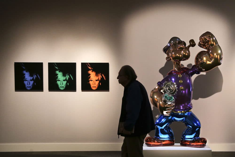 Jeff Koons' &quot;Popeye&quot; is seen at right at Sotheby's in New York before its 2014 sale to Steve Wynn. (Julie Jacobson/AP)