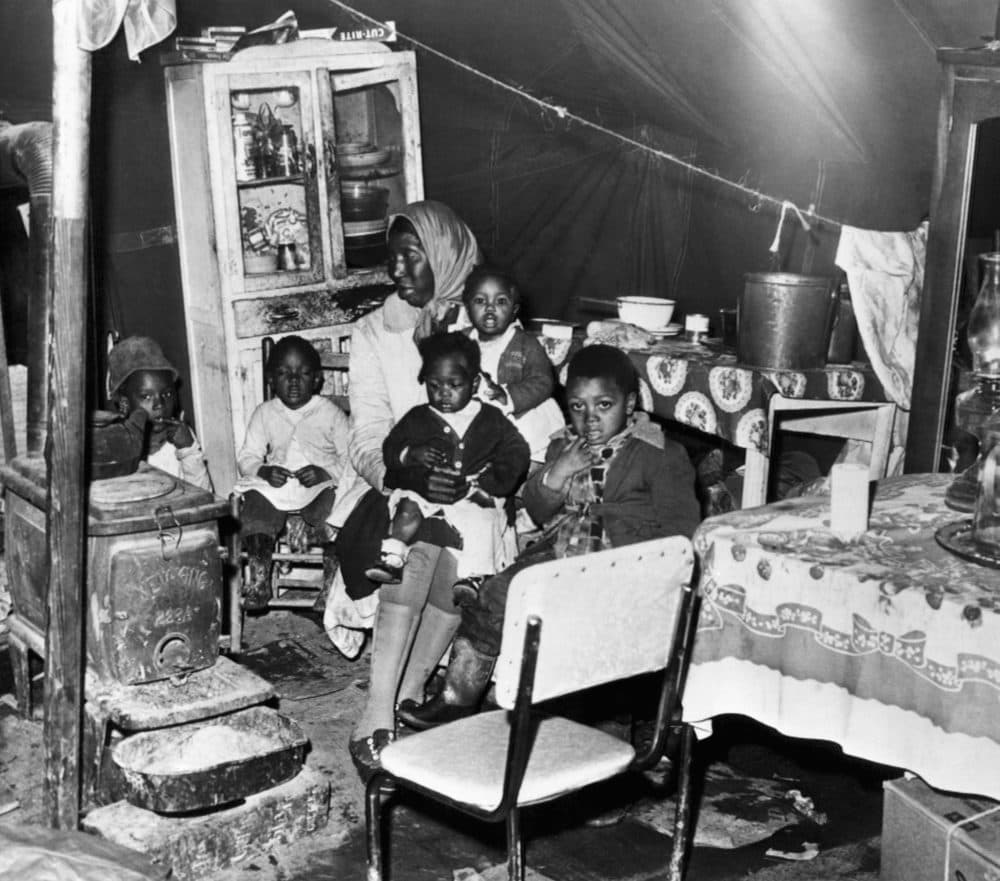 A mother and her five children are shown in a tent in the Tent City in Somerville, Tenn., where they were living, Jan. 2, 1961. (Perry Aycock/AP)