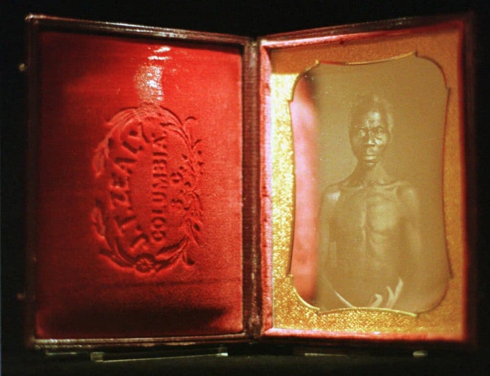 An 1850 daguerreotype of a slave named Renty, among the first photos taken by naturalist Louis Agassiz, is displayed in 1997 at San Francisco's Museum of Modern Art. (Andy Kuno/AP)