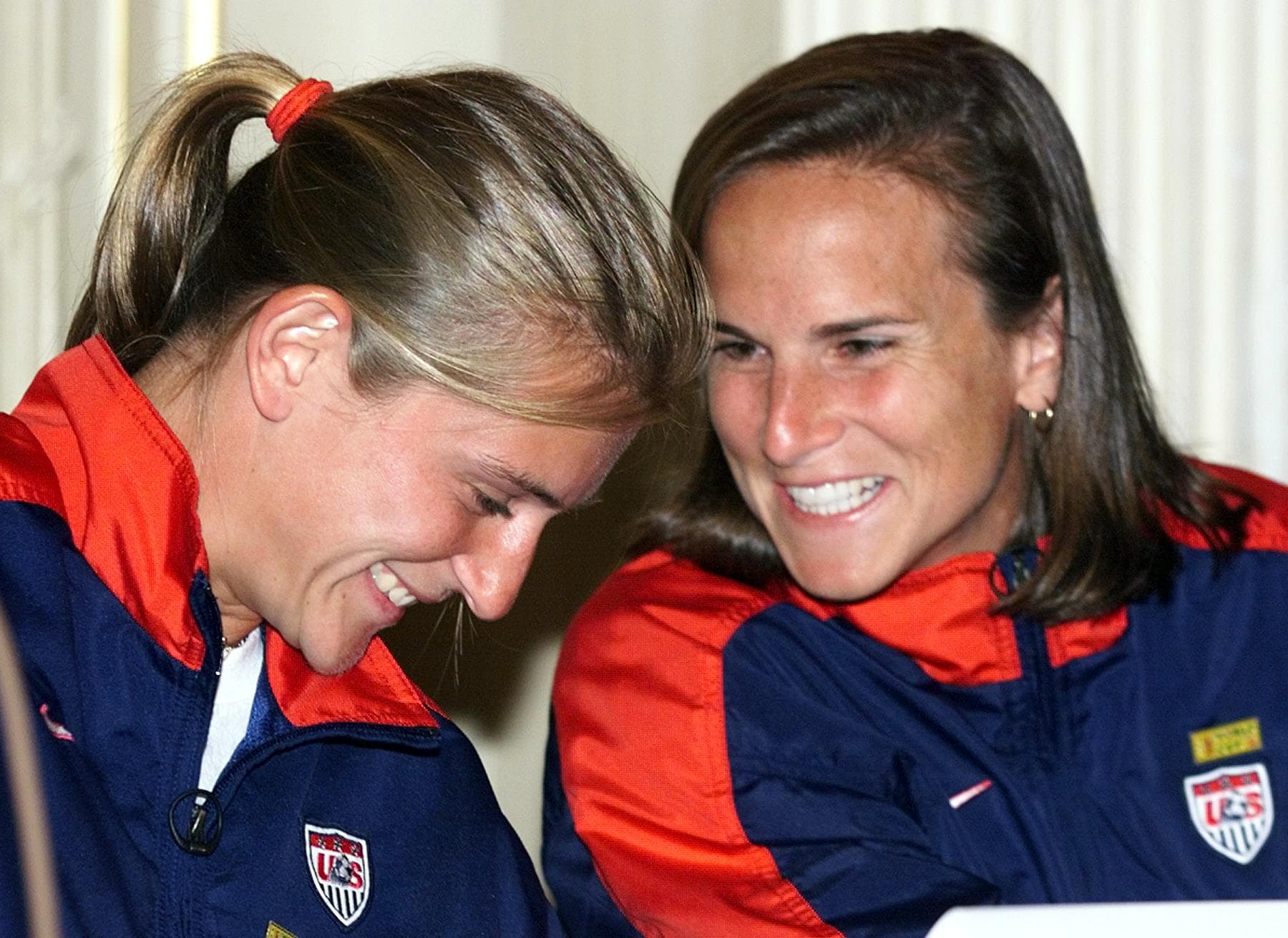 Team USA members Tiffeny Milbrett and Carla Overbeck. (Timothy Clary/AFP/Getty Images)