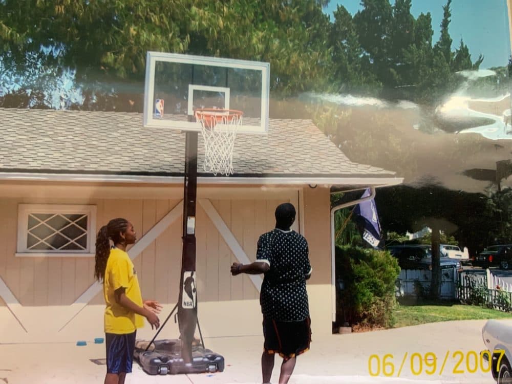 Lauren Holiday and her older brother, Jrue, playing basketball in their driveway. (Courtesy Lauren Holiday)