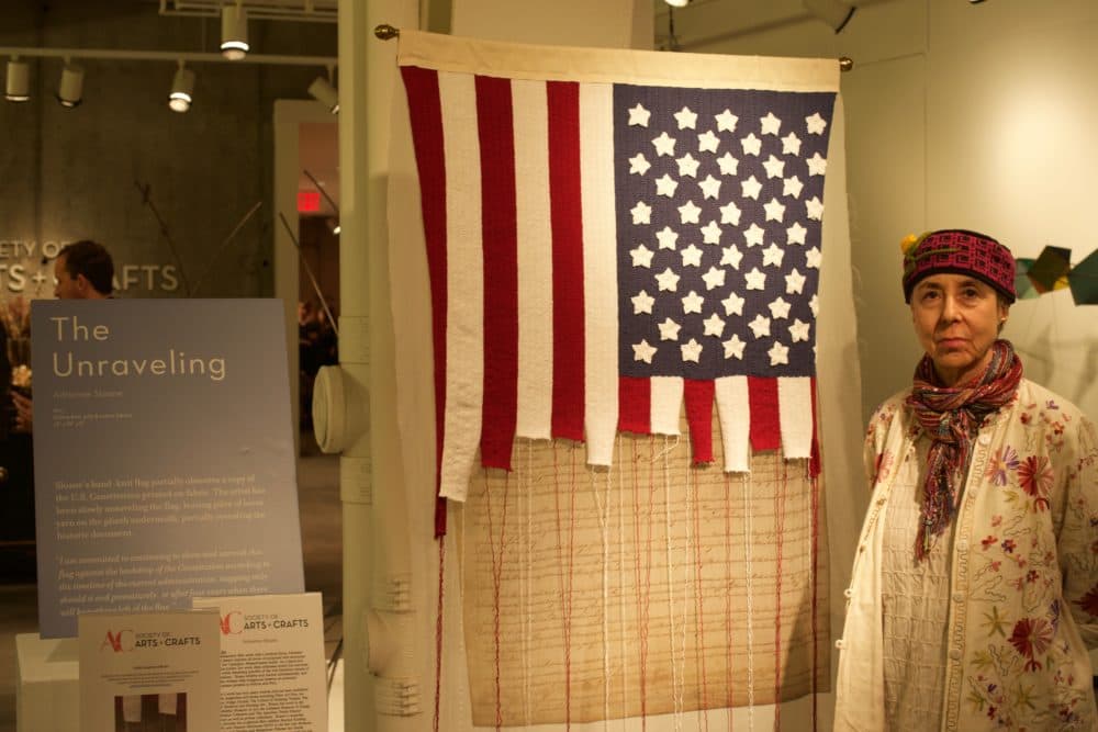 Adrienne Sloane next to her piece, &quot;The Unraveling.&quot; (Courtesy Society of Arts + Crafts)