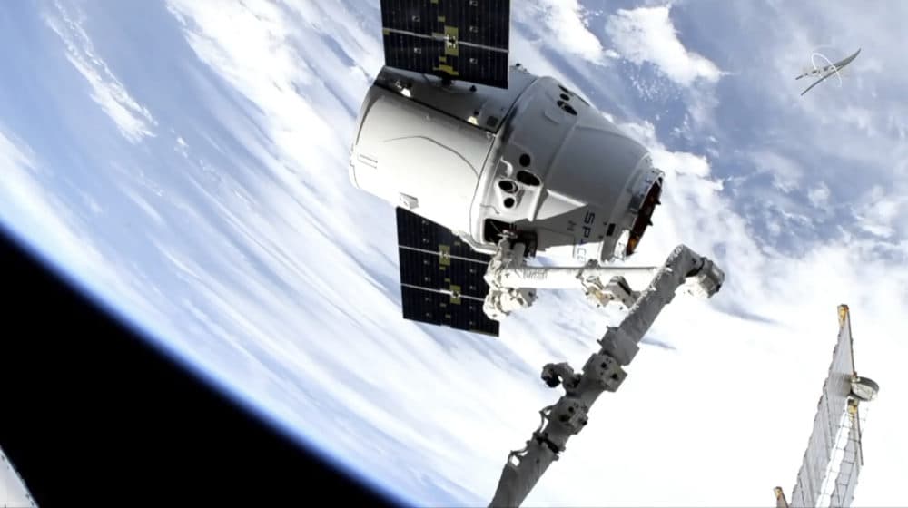 In this image taken from NASA Television, a SpaceX shipment arrives at the International Space Station following a weekend launch, Monday, May 6, 2019. The Dragon capsule reached the orbiting complex Monday, delivering 5,500 pounds (2,500 kilograms) of equipment and experiments. (NASA TV via AP)
