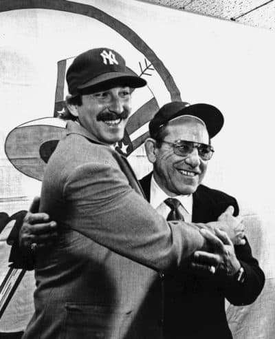 Dale Berra poses with his father at Yankee Stadium after being traded to New York. (Paul Burnett/AP)