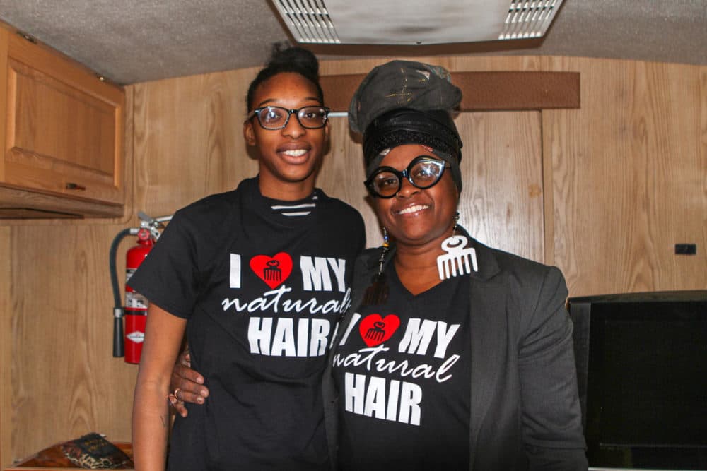 Queen Roshae, right, stands with her former student Slim who now helps with the Hair Matters classes. (Adora Namigadde/WOSU)