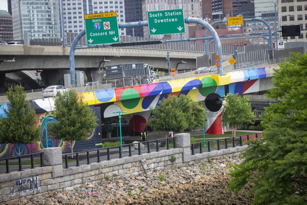 From afar, the oblong shapes on the bridge take shape as perfect circles. (Jesse Costa/WBUR)