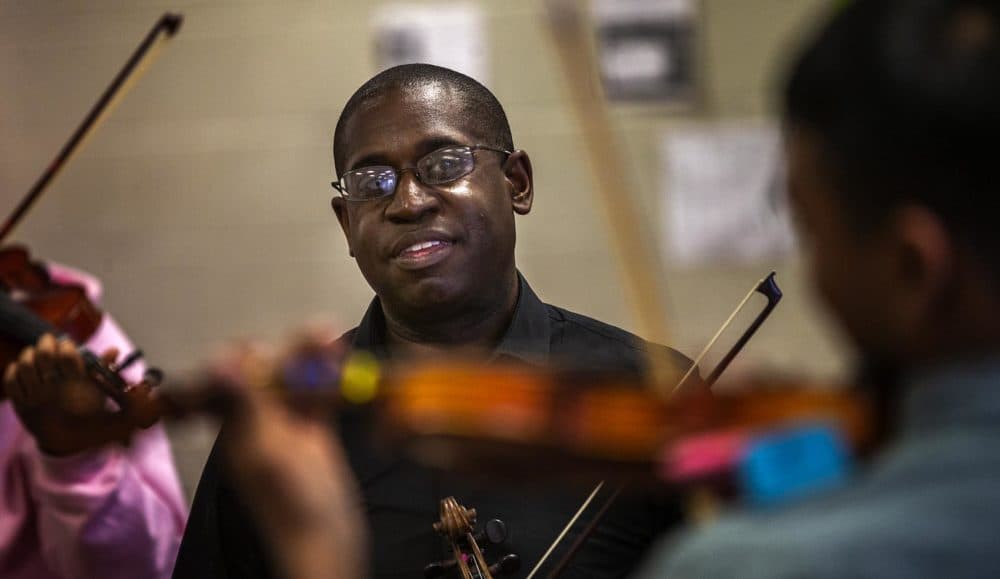 David France with members of his Roxbury Youth Orchestra (Jesse Costa/WBUR)