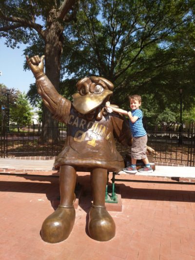 Silas posing with a statue of Cocky, the South Carolina mascot. (Courtesy Breanne Grace)