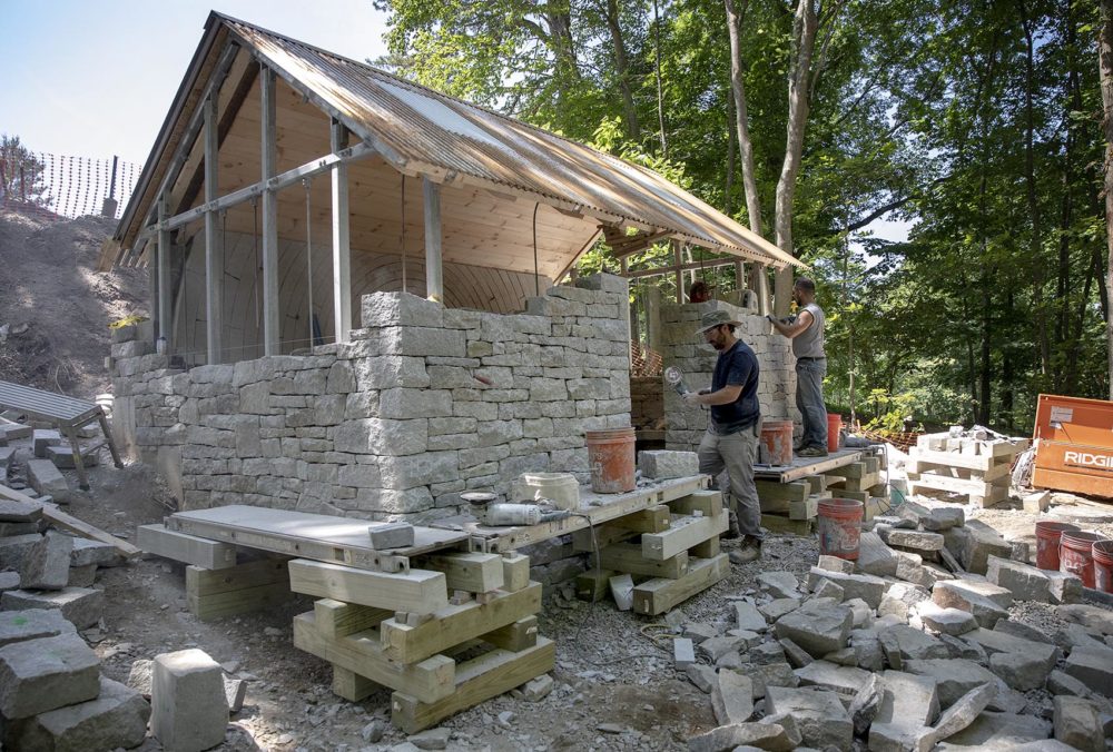 Dry stone wallers from the UK work on Watershed at deCordova. (Robin Lubbock/WBUR)