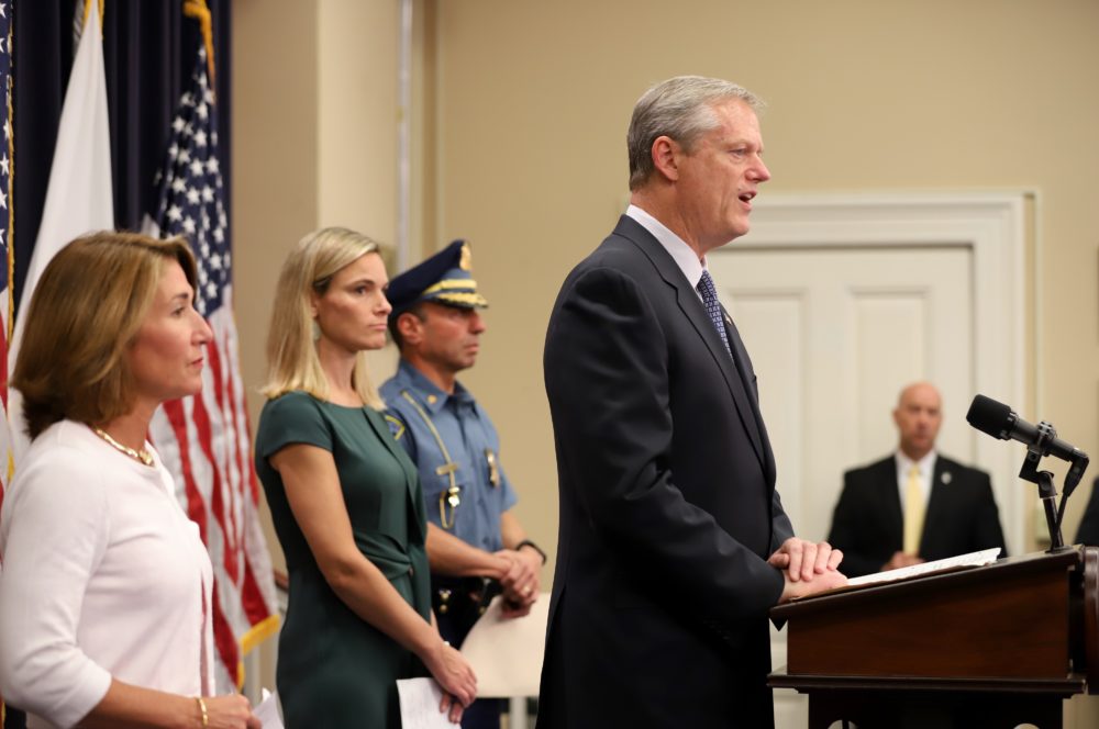 Gov. Charlie Baker announces his ride-hailing safety bill Wednesday alongside Lt. Gov. Karyn Polito, left, Energy and Environmental Affairs Secretary Kathleen Theoharides, whose office includes the Department of Public Utilities, and State Police Lt. Col. Robert Favuzza. (Sam Doran/SHNS)
