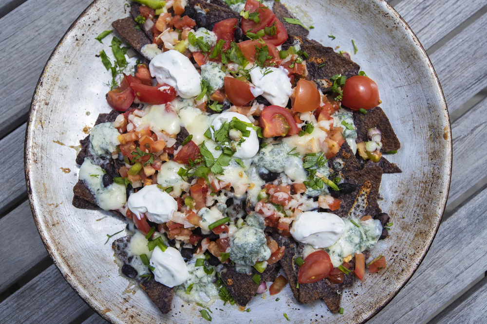 Blue corn nachos with tomatoes, salsa and sour cream, from chef Kathy Gunst. (Jesse Costa/WBUR)