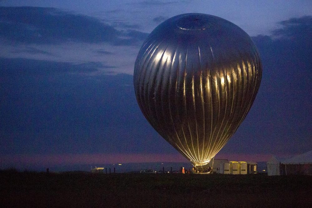 Doug Aitken's &quot;New Horizon,&quot; a hot air balloon site-specific installation, in the process of inflating on Martha's Vineyard. (Robin Lubbock/WBUR)