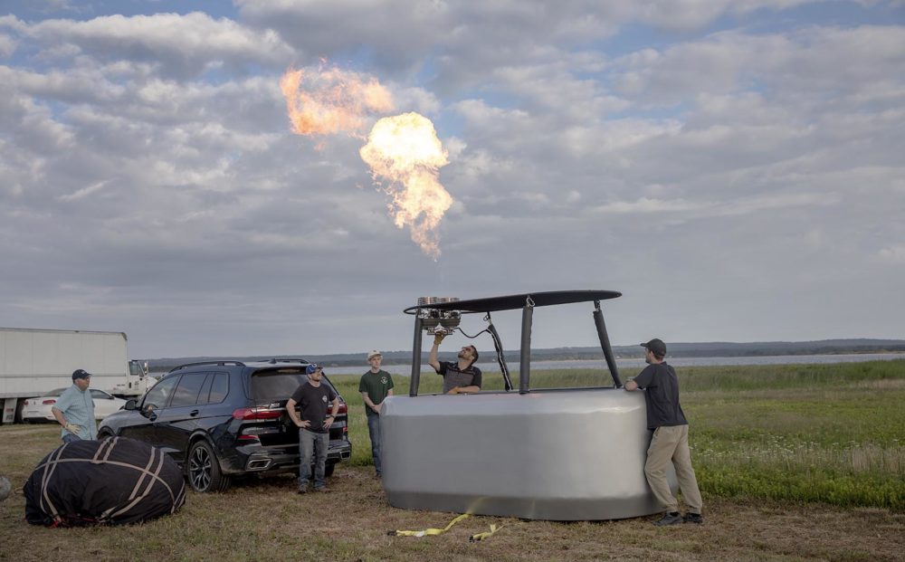 Pilot Andy Richardson tests the gas burners on the balloon's gondola. (Robin Lubbock/WBUR)