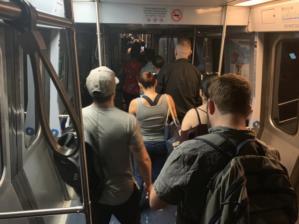Commuters on an MBTA Blue Line train are evacuated near Government Center on Wednesday morning. (Carrie Jung/WBUR)
