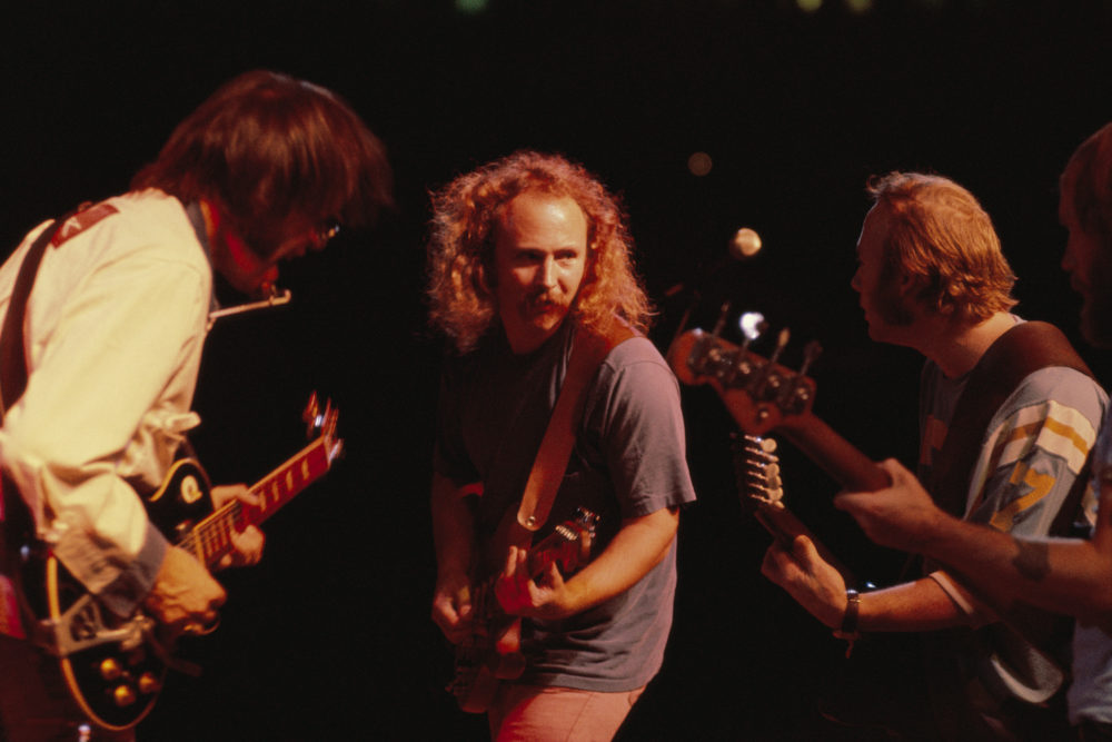 David Crosby (center), jamming with Neil Young (left), Stephen Stills (right) and Tim Drummond (bass), during a Crosby, Stills, Nash &amp; Young concert in 1974. (Courtesy of Sony Pictures Classics)