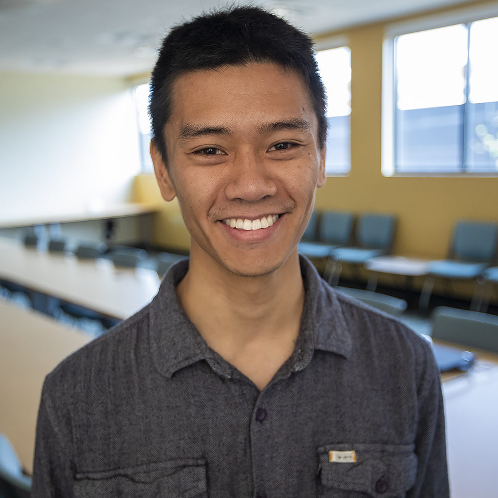 Headshot of Angus Chen