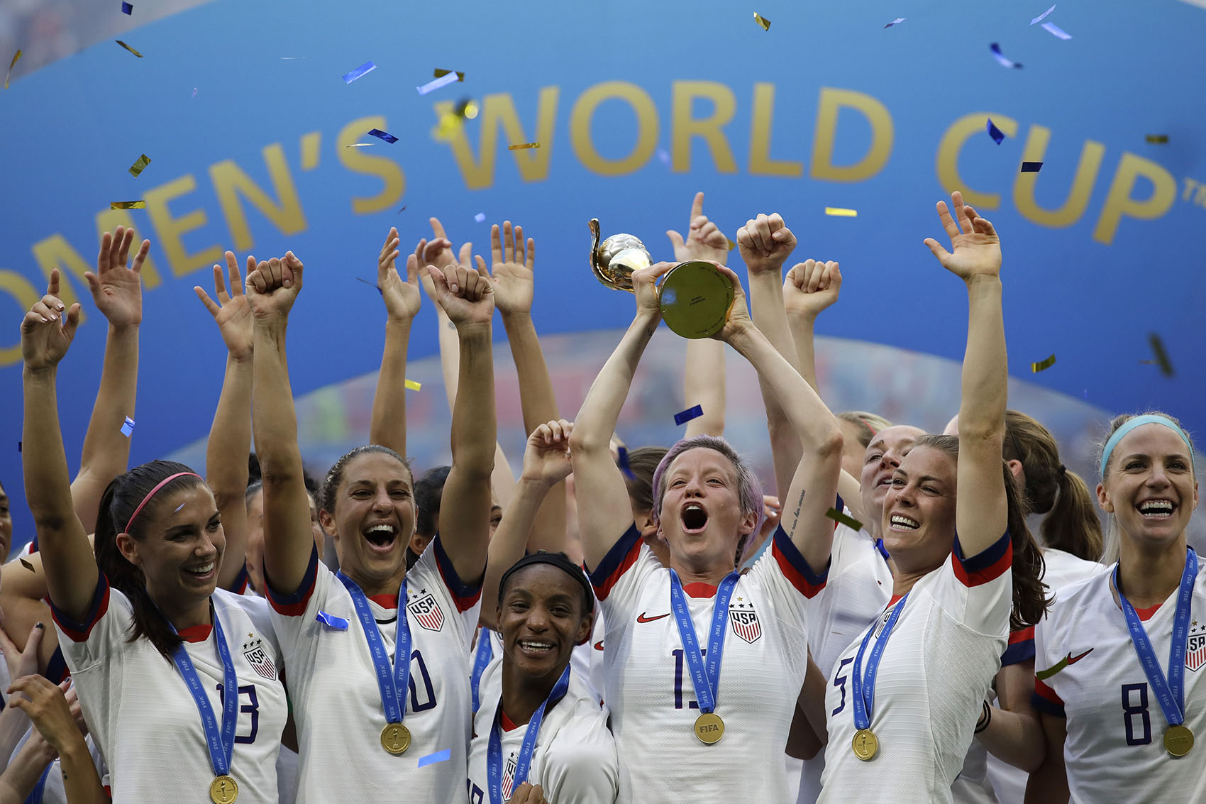 United States' Megan Rapinoe lifts up a trophy after winning the Women's World Cup final soccer match between U.S. and The Netherlands at the Stade de Lyon in Decines, outside Lyon, France, Sunday, July 7, 2019. (Alessandra Tarantino/AP)