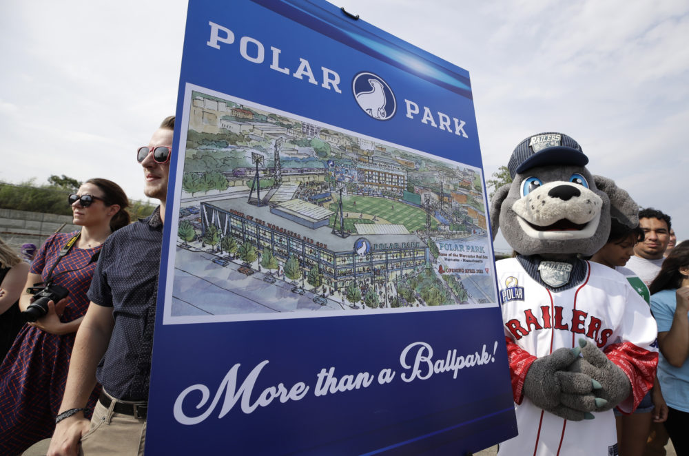 Spectators watch near an artist's rendering during a groundbreaking ceremony for a new minor league baseball stadium, July 11, 2019, in Worcester. Polar Park will be the new home of the Boston Red Sox' Triple-A affiliate, beginning in 2021. (Elise Amendola/AP)