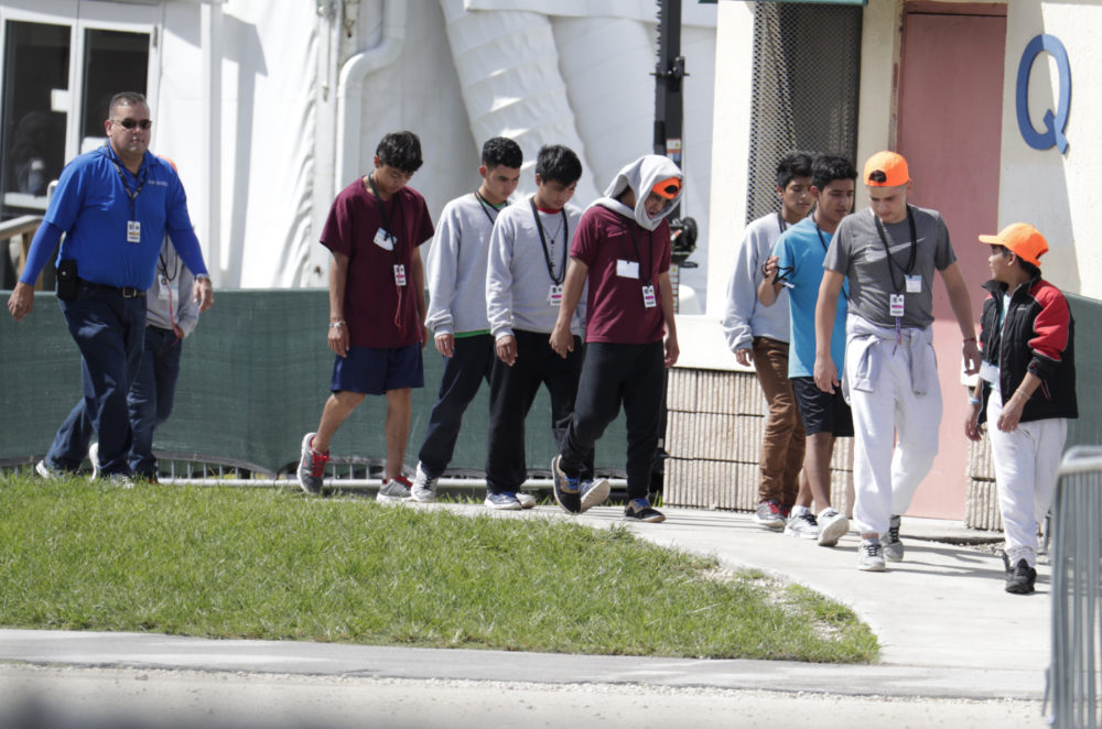 Migrant children walk on the grounds of the Homestead Temporary Shelter for Unaccompanied Children, Monday, July 15, 2019, in Homestead, Fla. (Lynne Sladky/AP)