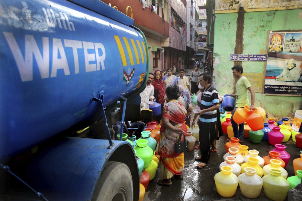 In this Monday, July 15, 2019, photo, people fill drinking water from a water tanker truck in Chennai, in the Southern Indian state of Tamil Nadu. Demand for water in India’s Motor City, a manufacturing and IT hub on the Bay of Bengal, far outstrips supply, forcing authorities to take extreme and costly measures to deliver potable water to its residents. (Manish Swarup/AP)