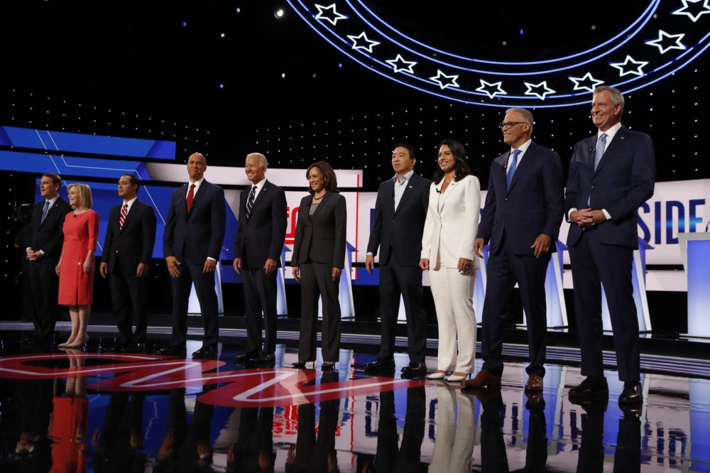 From left, Sen. Michael Bennet, D-Colo., Sen. Kirsten Gillibrand, D-N.Y., former Housing and Urban Development Secretary Julian Castro, Sen. Cory Booker, D-N.J., former Vice President Joe Biden, Sen. Kamala Harris, D-Calif., Andrew Yang, Rep. Tulsi Gabbard, D-Hawaii, Washington Gov. Jay Inslee and New York City Mayor Bill de Blasio are introduced before the second of two Democratic presidential primary debates hosted by CNN Wednesday, July 31, 2019, in the Fox Theatre in Detroit. (Carlos Osorio/AP)
