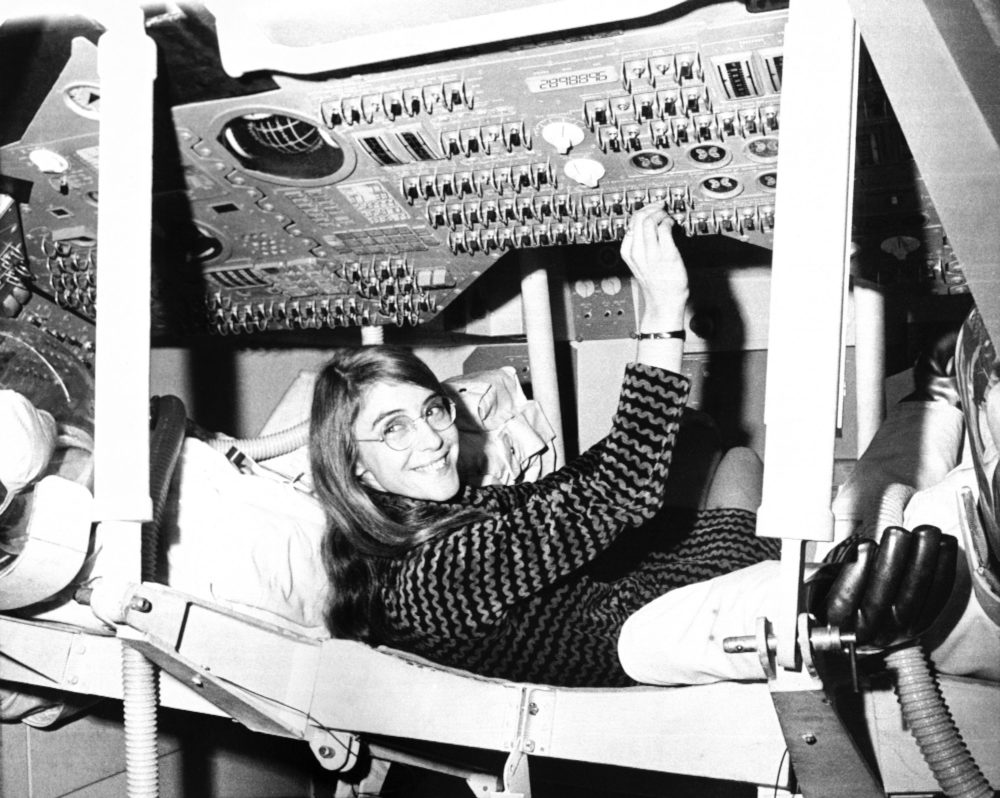 Margaret Hamilton, seen here in a mock-up of the Apollo command module in November 1969, headed a group at the MIT Instrumentation Lab that programmed the pinpoint landing on the moon. (AP)