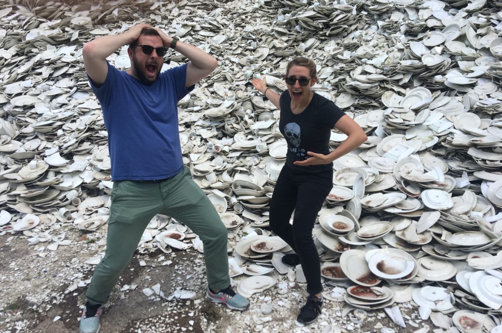 Ben and Amory in front of the pile of plates (Amory Sivertson/WBUR)