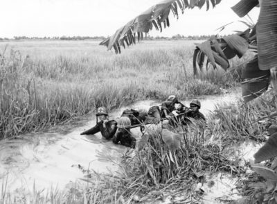 Vietnamese medics evacuate a seriously wounded comrade near Can Tho. (Michel Renard/AP)