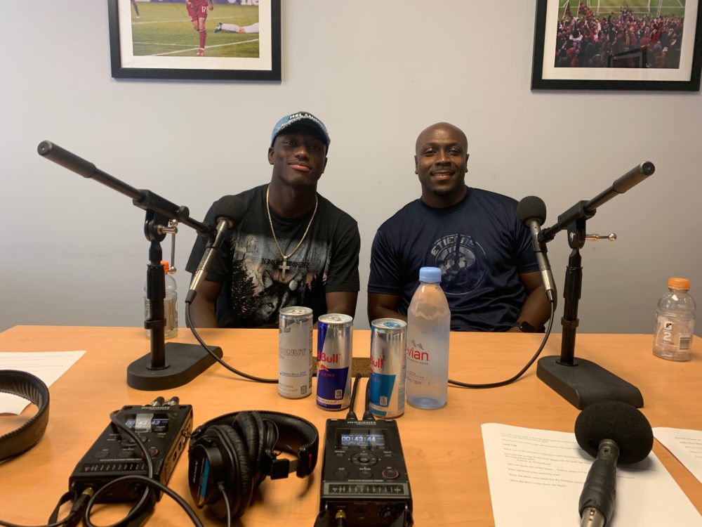 Derrick Etienne Jr. and his father Derrick Etienne Sr. at the New York Red Bulls Training Facility. (Niko Emack/WBUR)