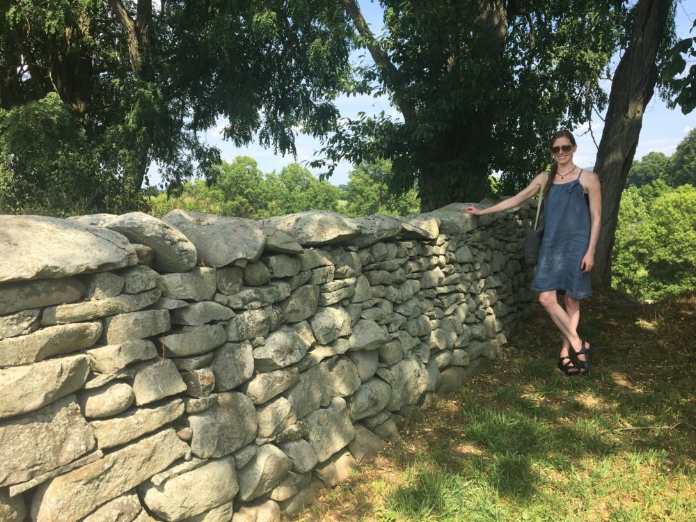 The author at &quot;Storm King Wall,&quot; Andy Goldsworthy's piece at the Storm King Art Center. (Courtesy Andrea Shea)