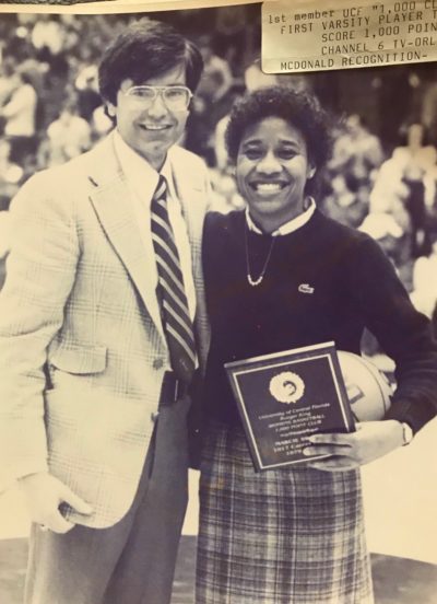 Marcie Washington (with Coach Joe Sanchez, left) being honored at a UCF basketball game for scoring 1,000 points in her career. (Courtesy Marcie Washington)
