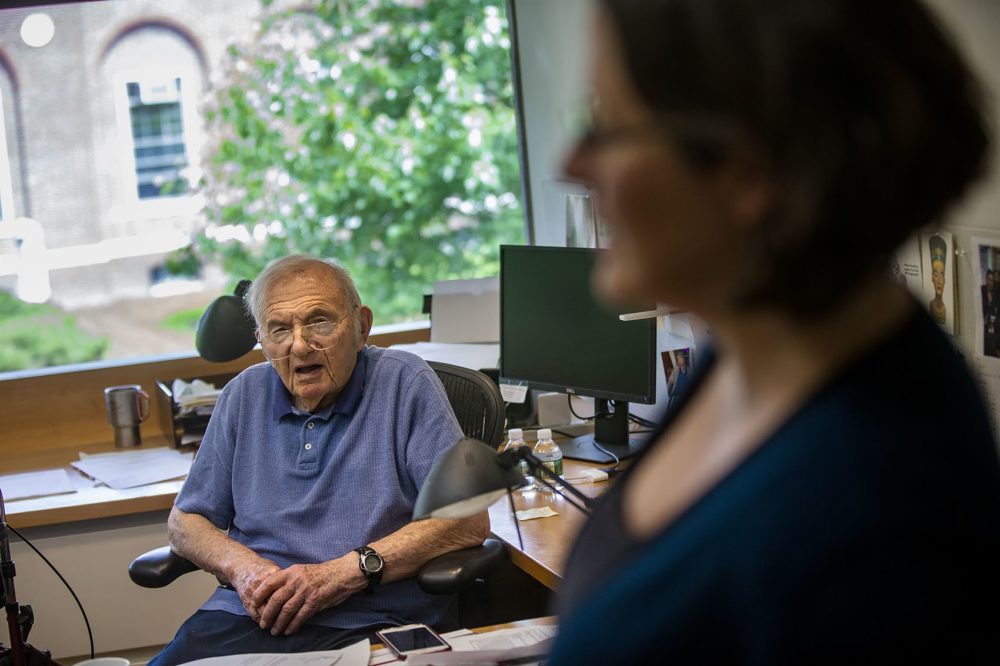 Jack Strominger speaks with researcher Tamara Tilburgs in his office. (Jesse Costa/WBUR)