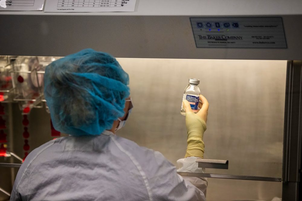 An MGH pharmacy technician prepares an intravenous medication for a patient at the hospital. (Jesse Costa/WBUR)